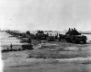 746px-US_Army_vehicles_rolling_off_Mulberry_A_16_June_1944.jpg