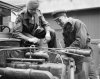 A sergeant of the RASC supervises an Austrian mechanic.jpg