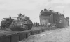 NARA 26-G-2370 British Sherman off LST-21 (A).png