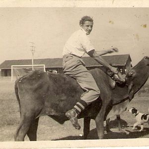 Dad On bullock with football boots as usual