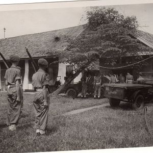 The coffin Of LAC Holbrook being placed On The carrier At The hospital