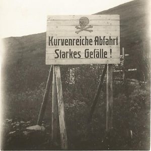 German sign in Norway warning of Dangerous Bends