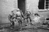 British_infantry_in_action_in_the_streets_of_Geilenkirchen,_Germany,_December_1944_BU1335.jpg