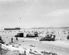 80-G-45714 - Omaha Beach disabled M4 and RAF trucks.jpeg