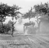 IWM photo B7523 - Sherman tank moves past road sign TANK TRACK PALM (18 Jul 44) .jpg