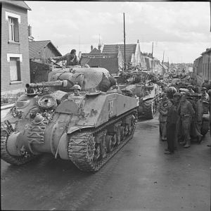 Sherman tanks of Guards Armoured Division passing through Villers-Bretonneux, 1 September 1944; IWM BU 268