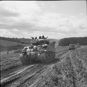 Sherman Firefly leads a column of Sherman tanks of Guards Armoured Division near Beauvais, 31 August 1944; IWM BU 298