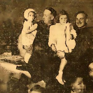 Looking for info about gentleman far right holding 3 year girl who is my mum